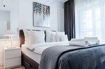 PATRONUS APARTMENTS w budynku Mennica Residence wynajem apartamentów na doby.